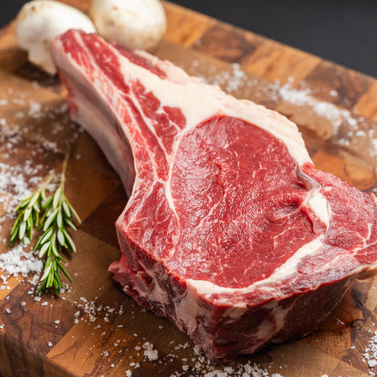 28 day aged 100% NZ grass-fed tomahawk steak – large, marbled, bone-in premium beef cut

