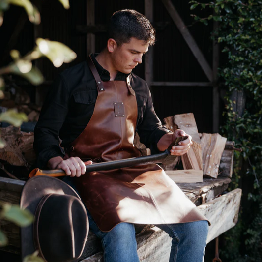 Cognac smooth leather apron with adjustable waist belt and neck strap, flame and spark resistant, durable and stylish workshop apron axe