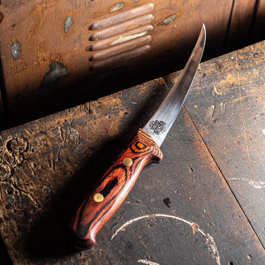 Victory Knives & Tattooed Butcher Full Tang Boning Knife 15cm – German stainless steel, custom handle, professional butchery knife, NZ made on bench

